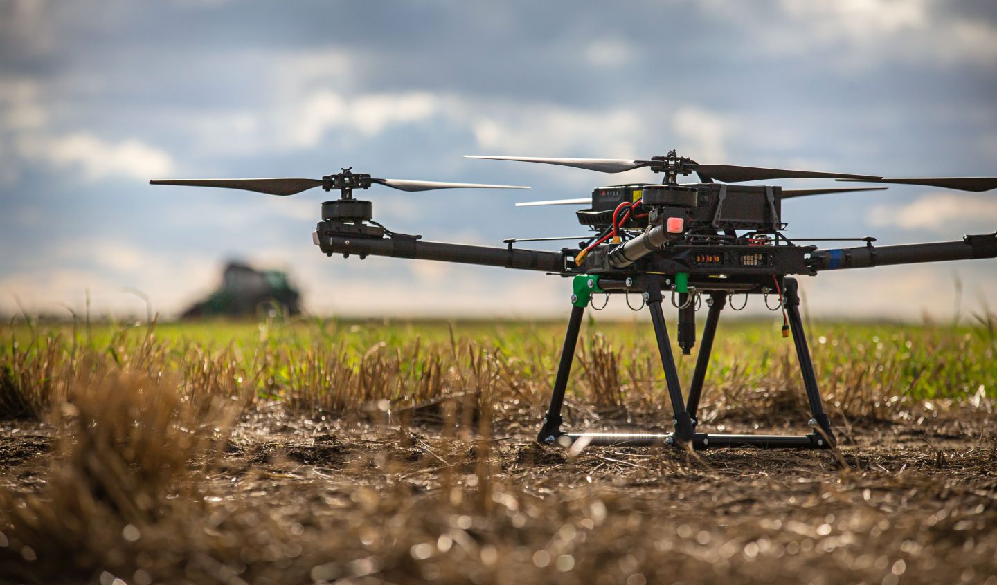 A drone positioned in a field, representing Saskatchewan’s advanced manufacturing and technological innovation.