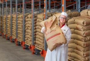 A person holding a bag of oats